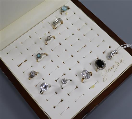 Ten assorted modern 9ct gold dress rings, with ring display box.